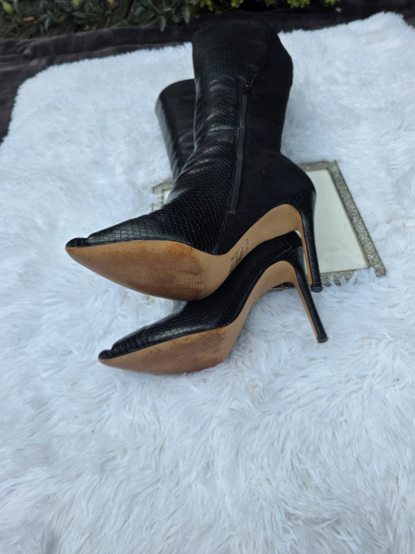 A Aldo knee high boots size 7.5